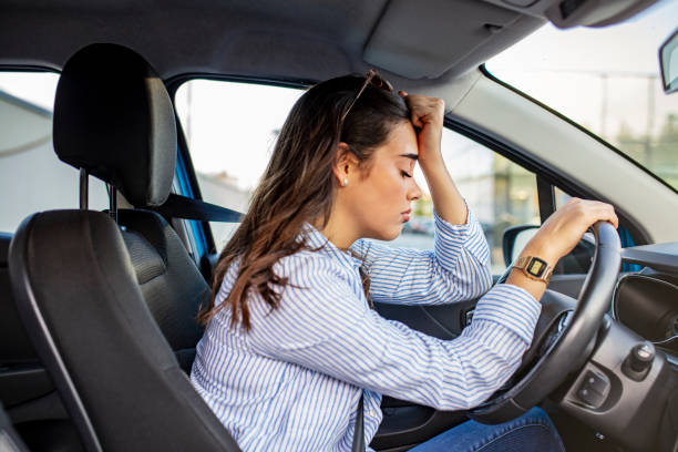 Mindfulness Techniques For Driving Anxiety-Stressed woman drive car feeling sad and angry. Girl tired, fatigue mental on car.